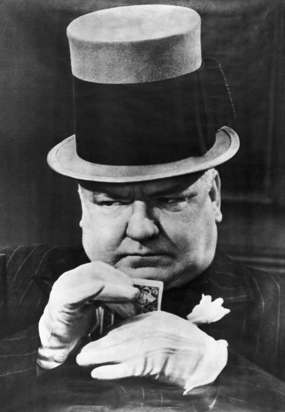 Original Caption: W.C. Fields in typical poker face pose.  Undated photograph.